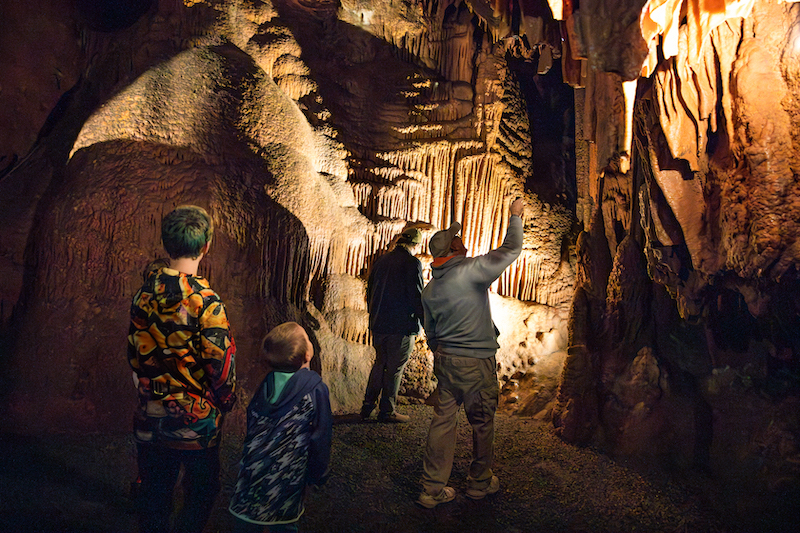 People touring an underground cave.