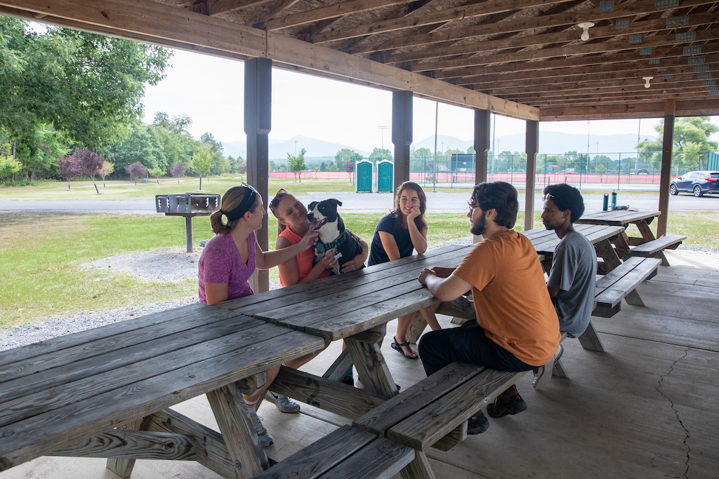 People in a picnic shelter.