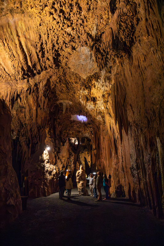 People exploring Grand Caverns.